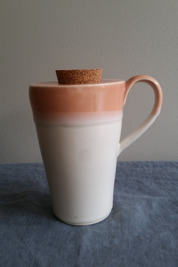 Travel mug in Coral Glaze by Muddy Marvels Handmade Pottery Squamish