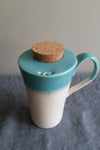 Travel mug in Teal glaze by Muddy Marvels Handmade Pottery Squamish